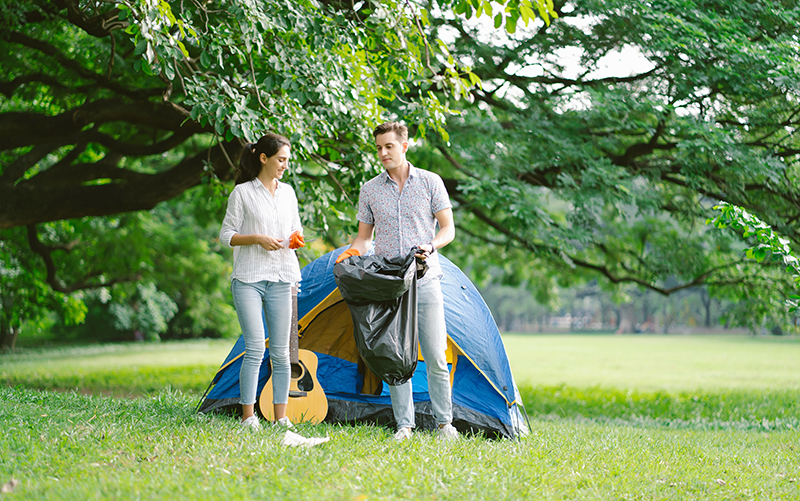 eco,friendly,happy,couple,wearing,orange,gloves,cleans,plastic,and